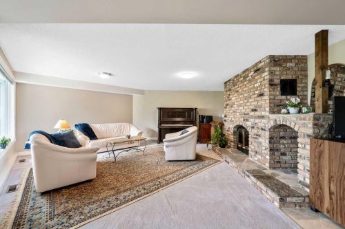 251018 Tower Ridge Estates, Rural Rocky View County, AB - Indoor With Fireplace