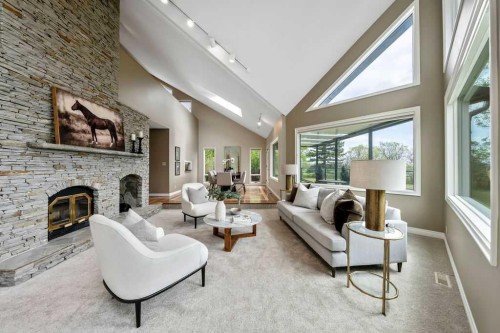 251018 Tower Ridge Estates, Rural Rocky View County, AB - Indoor Photo Showing Living Room With Fireplace