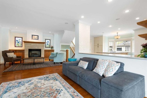 2402 Bowness Road Nw, Calgary, AB - Indoor Photo Showing Living Room With Fireplace