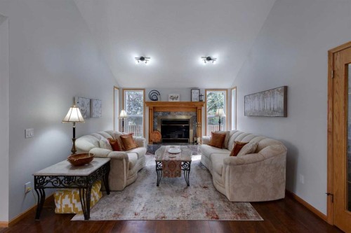 616 Memorial Avenue, Vulcan, AB - Indoor Photo Showing Living Room With Fireplace