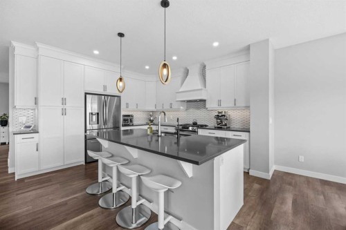 142 Sandstone Drive, Okotoks, AB - Indoor Photo Showing Kitchen With Upgraded Kitchen