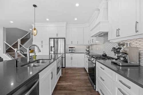 142 Sandstone Drive, Okotoks, AB - Indoor Photo Showing Kitchen With Double Sink With Upgraded Kitchen