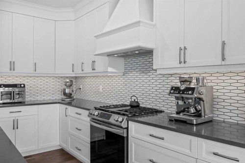142 Sandstone Drive, Okotoks, AB - Indoor Photo Showing Kitchen With Upgraded Kitchen