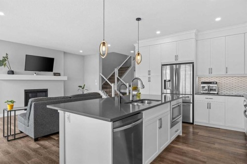 142 Sandstone Drive, Okotoks, AB - Indoor Photo Showing Kitchen With Double Sink With Upgraded Kitchen