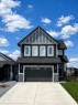 142 Sandstone Drive, Okotoks, AB  - Outdoor With Facade 