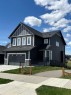 142 Sandstone Drive, Okotoks, AB  - Outdoor With Facade 