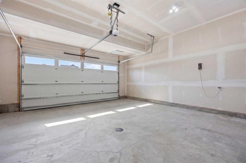 142 Sandstone Drive, Okotoks, AB - Indoor Photo Showing Garage