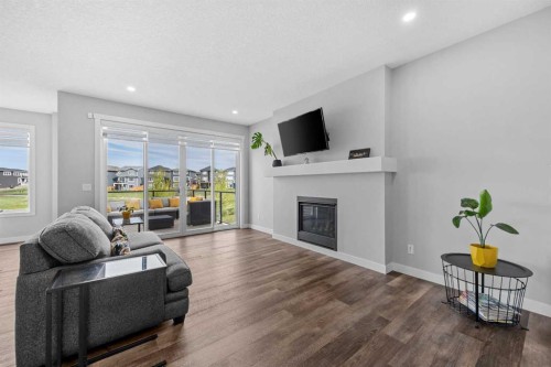142 Sandstone Drive, Okotoks, AB - Indoor Photo Showing Living Room With Fireplace