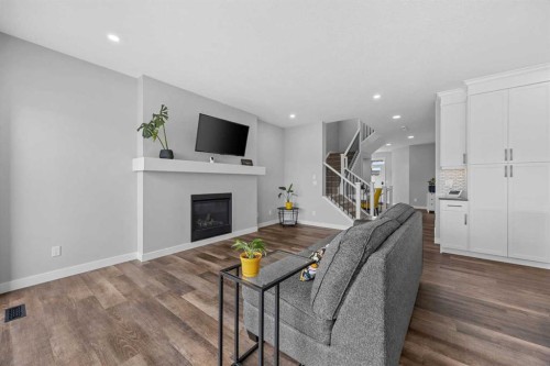 142 Sandstone Drive, Okotoks, AB - Indoor Photo Showing Living Room With Fireplace