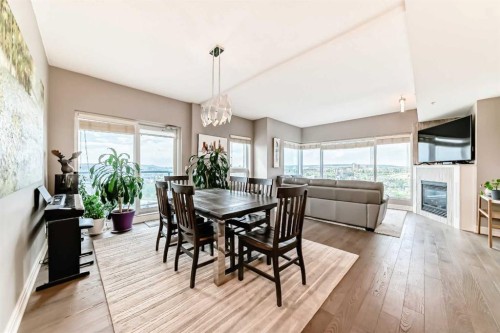 2101-920 5 Avenue Sw, Calgary, AB - Indoor Photo Showing Dining Room With Fireplace