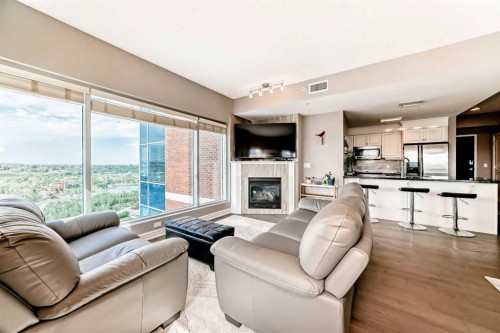 2101-920 5 Avenue Sw, Calgary, AB - Indoor Photo Showing Living Room With Fireplace