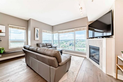 2101-920 5 Avenue Sw, Calgary, AB - Indoor Photo Showing Living Room With Fireplace