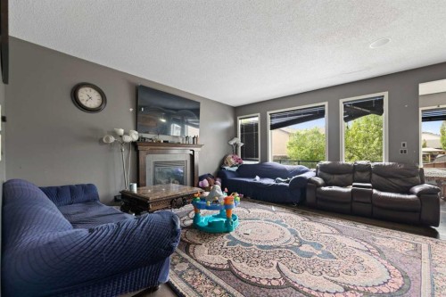 34 Brightoncrest Common Se, Calgary, AB - Indoor Photo Showing Living Room With Fireplace
