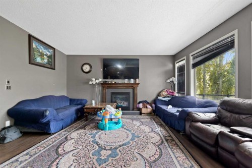 34 Brightoncrest Common Se, Calgary, AB - Indoor Photo Showing Living Room With Fireplace