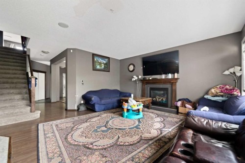 34 Brightoncrest Common Se, Calgary, AB - Indoor Photo Showing Living Room With Fireplace