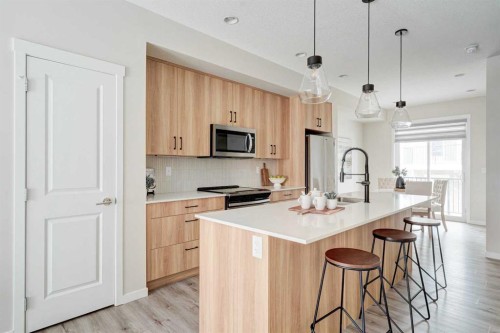 1409-355 Nolancrest Heights Nw, Calgary, AB - Indoor Photo Showing Kitchen With Stainless Steel Kitchen With Upgraded Kitchen