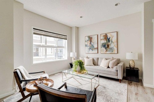 1409-355 Nolancrest Heights Nw, Calgary, AB - Indoor Photo Showing Living Room
