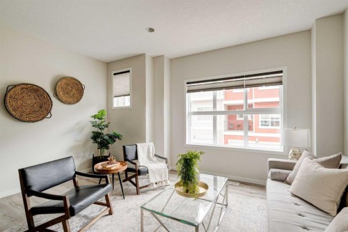 1409-355 Nolancrest Heights Nw, Calgary, AB - Indoor Photo Showing Living Room