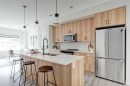 1409-355 Nolancrest Heights Nw, Calgary, AB  - Indoor Photo Showing Kitchen With Stainless Steel Kitchen With Double Sink With Upgraded Kitchen 