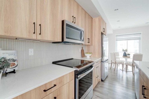 1409-355 Nolancrest Heights Nw, Calgary, AB - Indoor Photo Showing Kitchen With Upgraded Kitchen