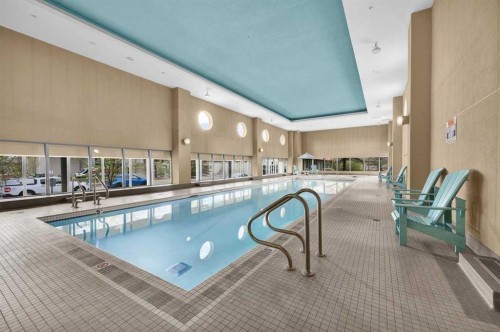 2203-77 Spruce Place Sw, Calgary, AB - Indoor Photo Showing Other Room With In Ground Pool