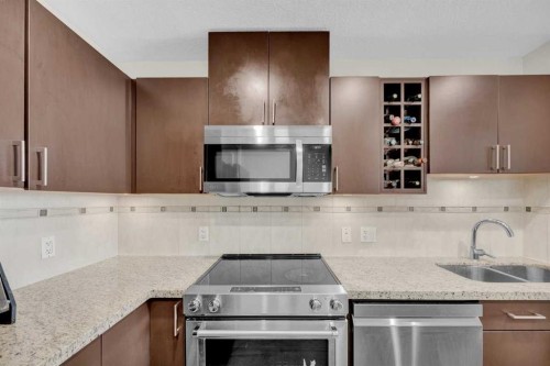 2203-77 Spruce Place Sw, Calgary, AB - Indoor Photo Showing Kitchen With Double Sink