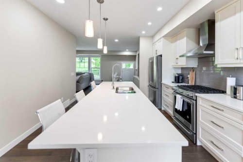 165 Cranbrook Villas Se, Calgary, AB - Indoor Photo Showing Kitchen With Double Sink With Upgraded Kitchen
