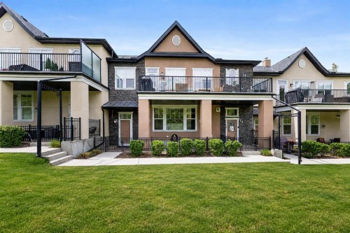 165 Cranbrook Villas Se, Calgary, AB - Outdoor With Deck Patio Veranda With Facade