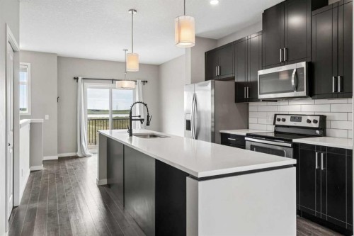 120 Copperstone Villas Se, Calgary, AB - Indoor Photo Showing Kitchen With Upgraded Kitchen