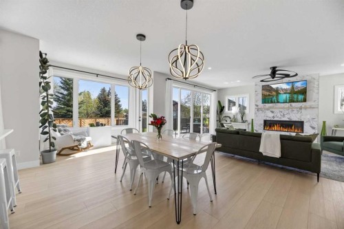 30 Silverstone Place, Didsbury, AB - Indoor Photo Showing Dining Room With Fireplace