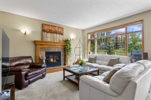 322 Hampstead Way Nw, Calgary, AB - Indoor Photo Showing Living Room With Fireplace