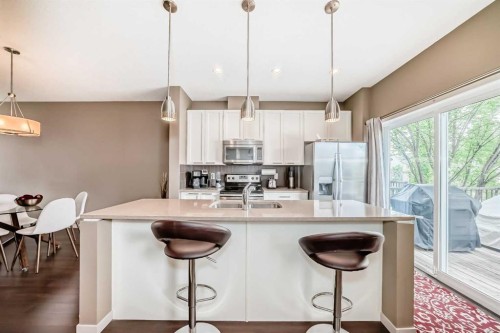 205 Copperpond Row Se, Calgary, AB - Indoor Photo Showing Kitchen With Stainless Steel Kitchen With Double Sink With Upgraded Kitchen