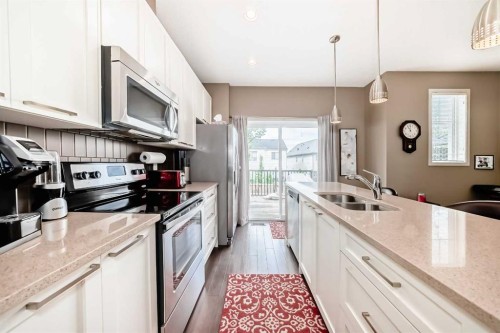 205 Copperpond Row Se, Calgary, AB - Indoor Photo Showing Kitchen With Double Sink With Upgraded Kitchen
