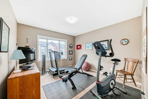 205 Copperpond Row Se, Calgary, AB - Indoor Photo Showing Gym Room