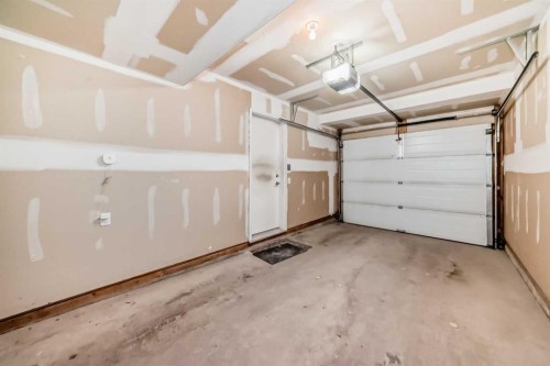 205 Copperpond Row Se, Calgary, AB - Indoor Photo Showing Garage