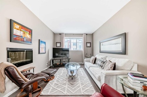 205 Copperpond Row Se, Calgary, AB - Indoor Photo Showing Living Room With Fireplace