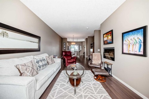 205 Copperpond Row Se, Calgary, AB - Indoor Photo Showing Living Room With Fireplace