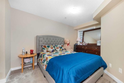 309-7110 80 Avenue Ne, Calgary, AB - Indoor Photo Showing Bedroom