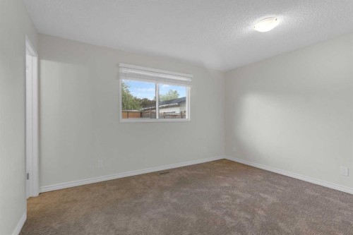 452 Queen Alexandra Way Se, Calgary, AB - Indoor Photo Showing Other Room