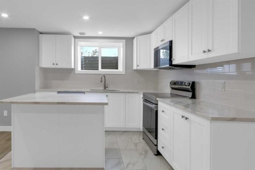 452 Queen Alexandra Way Se, Calgary, AB - Indoor Photo Showing Kitchen With Upgraded Kitchen