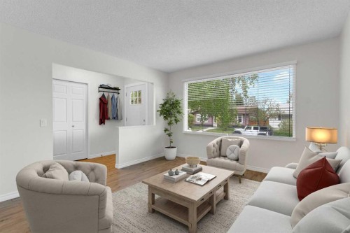 452 Queen Alexandra Way Se, Calgary, AB - Indoor Photo Showing Living Room