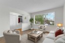 452 Queen Alexandra Way Se, Calgary, AB  - Indoor Photo Showing Living Room 