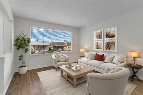452 Queen Alexandra Way Se, Calgary, AB - Indoor Photo Showing Living Room