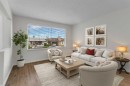 452 Queen Alexandra Way Se, Calgary, AB  - Indoor Photo Showing Living Room 