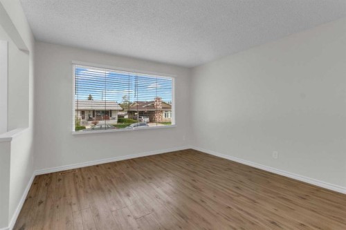 452 Queen Alexandra Way Se, Calgary, AB - Indoor Photo Showing Other Room