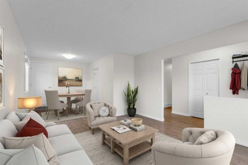 452 Queen Alexandra Way Se, Calgary, AB - Indoor Photo Showing Living Room