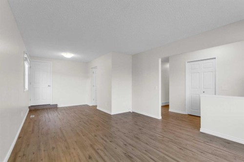452 Queen Alexandra Way Se, Calgary, AB - Indoor Photo Showing Other Room