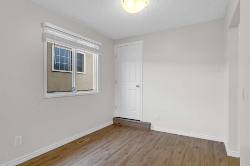 452 Queen Alexandra Way Se, Calgary, AB - Indoor Photo Showing Other Room