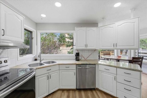 13919 Evergreen Street Sw, Calgary, AB - Indoor Photo Showing Kitchen With Double Sink
