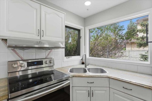 13919 Evergreen Street Sw, Calgary, AB - Indoor Photo Showing Kitchen With Double Sink
